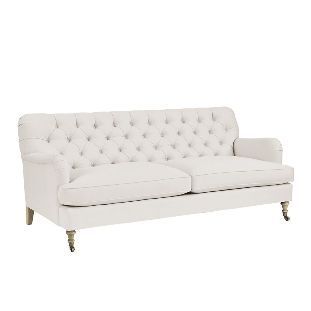 Maggie upholstered sofa in off-white fabric with tufted back and classic silhouette for a refined living room